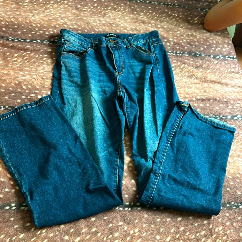 d. Jeans, size 14, dark washed.